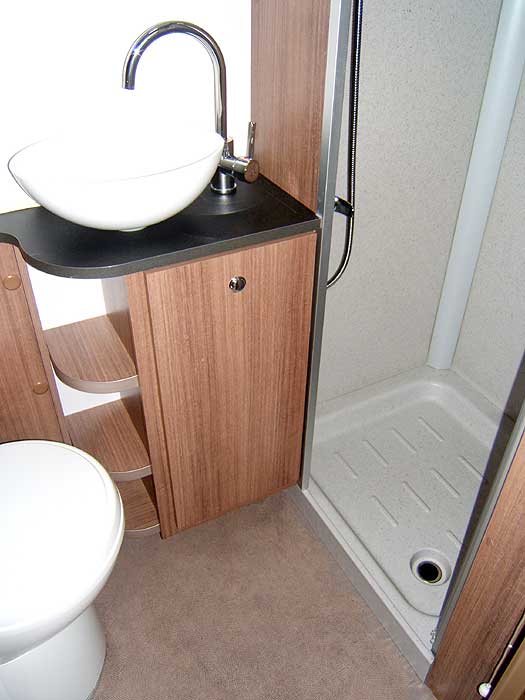 The washbasin and shower cubicle.